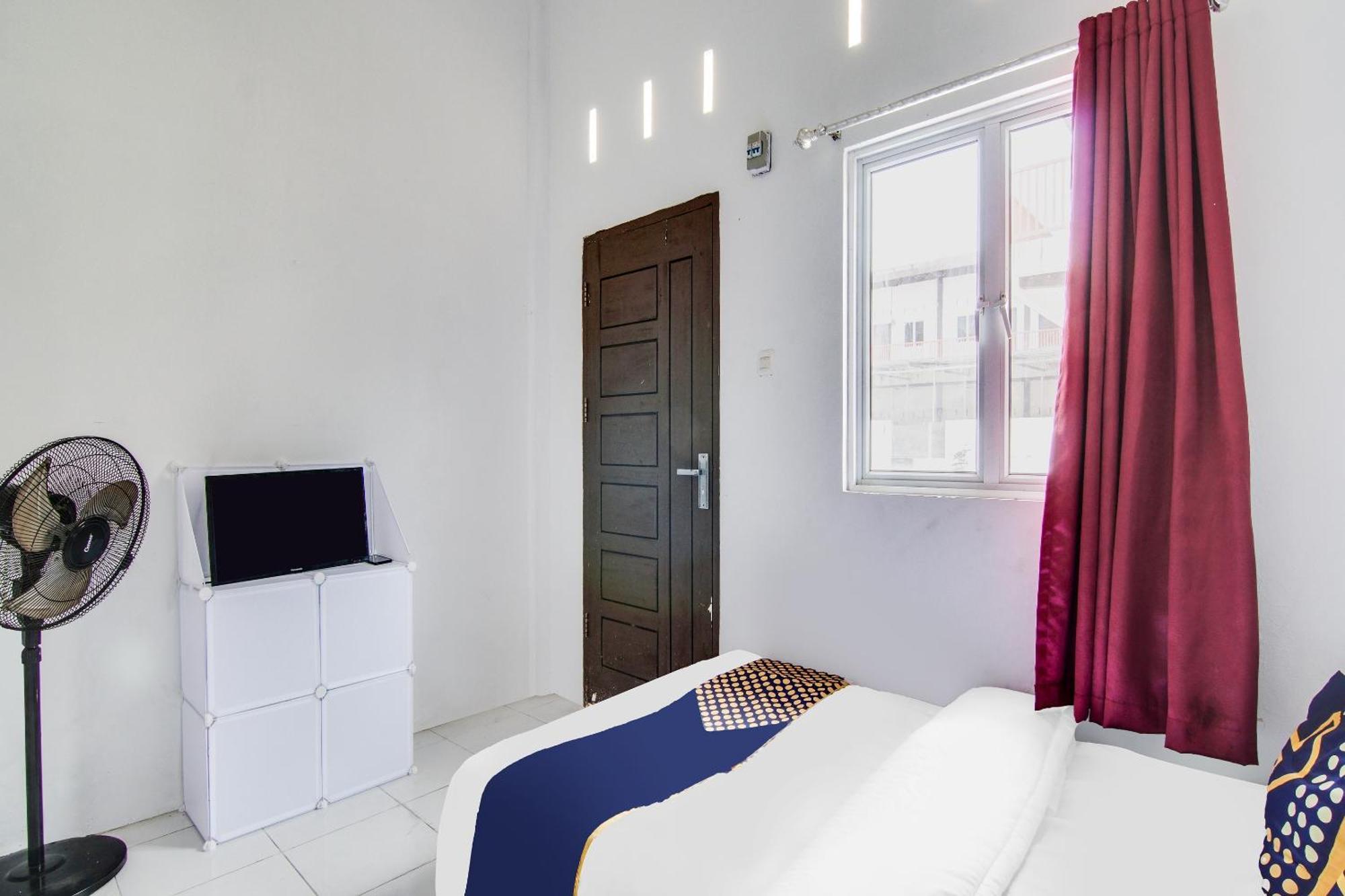 Spot On 91858 Raja Homestay Syariah Pekanbaru Buitenkant foto